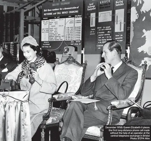  ?? ?? December 1958: Queen Elizabeth II places the first long-distance phone call made without the help of an operator at the central telephone exchange in Bristol Photo: BT/PA Wire