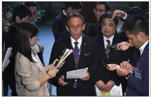  ?? AP/EUGENE HOSHIKO ?? “I want to appeal to America” about Okinawans’ desire to move the U.S. Marine base off the island, Okinawa Gov. Denny Tamaki (center) said Friday after meeting with Japanese Prime Minister Shinzo Abe.