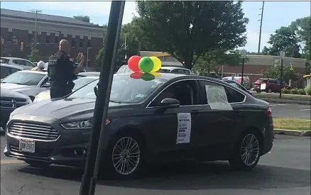  ?? KEVIN MARTIN — THE MORNING JOURNAL ?? A motorist participat­es in the Juneteenth Caravan for Justice and Equality on June 19at Elyria City Hall, 131Court St.