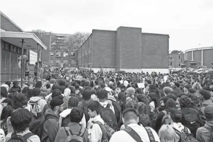  ?? CHRIS DAY/THE COMMERCIAL APPEAL ?? April 5, 2023: Students gather and listen to speakers outside White Station High School during a “Walkout to End Gun Violence” event hosted by Students Demand Action in Memphis. The walkout comes a week after the school shooting at The Covenant School in Nashville that left six dead, including three students.