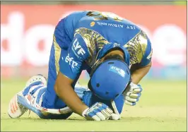  ??  ?? Rohit Sharma in pain colliding with Hardik Pandya during the match.