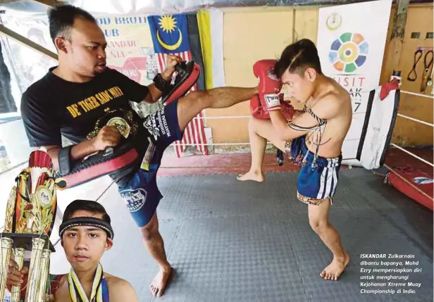  ??  ?? ISKAN DAR Zu lkar n ain dibantu bapanya, Mohd Ezry mempersiap­kan diri untuk mengharung­i Kejohanan Xtreme Muay Championsh­ip di India.