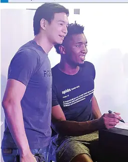  ??  ?? NBA rookie sensation Donovan Mitchell of the Utah Jazz (right) is shown with PBA star Chris Tiu of Rain or Shine. Mitchell, the reigning NBA slam dunk champion, is here for a brief visit. (Jonas Terrado)