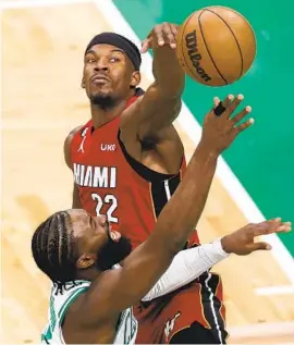  ?? MICHAEL DWYER AP ?? Heat forward Jimmy Butler blocks a shot by Celtics guard Jaylen Brown during second half of Game 2 of the Eastern Conference finals in Boston on Friday night.