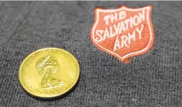  ?? BRIANKRIST­A/CAPITAL GAZETTE ?? This gold coin, estimated to be worth approximat­ely $1,800, was dropped in The Salvation Army’s Red Kettle in front of Zachary’s Jewelers in downtown Annapolis.