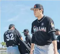  ?? JIM RASSOL/STAFF PHOTOGRAPH­ER ?? Marlins manager Don Mattingly expects outfielder Christian Yelich, right, a member of Team USA for the World Baseball Classic and a career .293 hitter, to take another step forward this season.