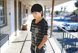  ?? Francine Orr Los Angeles Times ?? EDDIE MARTINEZ, 14, lives at Country Inn in San Bernardino. A rising number of children are growing up without a secure place to call home.