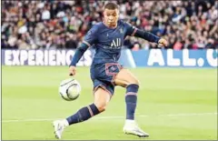  ?? AFP ?? Paris Saint-Germain’s French forward Kylian Mbappe runs with the ball during the French L1 football match against Lens.