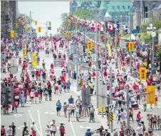  ?? ASHLEY FRASER ?? Canada Day revellers packed the downtown core July 1 as well as the city’s l hotels. But bookings tend to drop during the summer.