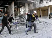  ?? SYRIAN CIVIL DEFENSE WHITE HELMETS FILE 2018 ?? Syrian rescue workers known as the White Helmets were evacuated from a dangerous area of Syria through a coordinate­d effort by Israel, the U.S. and European allies.