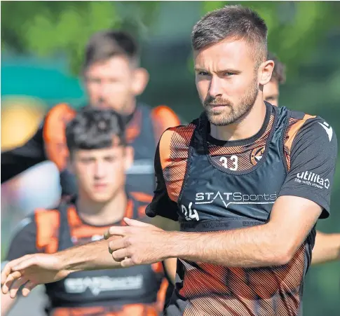  ??  ?? SETTLING IN: Dundee United’s deadline day signing Scott McMann training with his new team-mates at the Tannadice club’s training base in St Andrews.