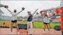  ?? Lee Jin-man The Associated Press ?? SK Wyvern cheerleade­rs root for their team during a fanless May 5 game against the Hanwha Eagles in Incheon, South Korea.