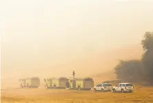  ?? Jessica Christian / the Chronicle ?? Heavy smoke fills the Olema Valley at Point Reyes National Seashore near the Bear Valley Visitors Center, where firefighte­rs are working to hold the eastern fire line.