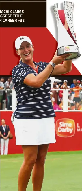  ?? — IZZRAFIQ ALIAS / The Star ?? Iron lady: Cristie Kerr holding the trophy after winning the Sime Darby LPGA Malaysia at the TPC Kuala Lumpur yesterday.