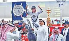  ?? Clint Egbert/ Gulf News ?? ■ Jockey Roberto Perez, riding Tallaab Al Khalediah, celebrates after winning the Dubai Kahayla Classic ( Group 1) race