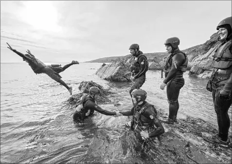  ?? — Photo courtesy Visit Wales ?? Coasteerin­g is the interdisci­plinary adventure sport invented in Wales that combines swimming, rock climbing and cliff jumping.