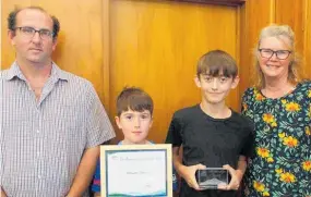  ?? Photo / Alyssa Smith ?? In 2021, Ratapiko School received an environmen­tal award. Pictured is John Marriner, pupils Blayke Collins and Alex Young, and principal Lisa Hill.