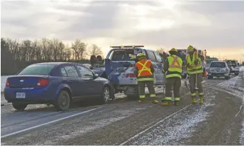  ?? [VERONICA REINER / THE OBSERVER] ?? Traffic was slowed January 11 after a blue Chevrolet Cobalt rear-ended another vehicle near the St. Jacobs roundabout on Arthur Street.