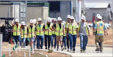  ?? RECORDER PHOTOS BY CHIEKO HARA ?? Donning hard hats and vests, Harmony Magnet Academy engineerin­g students tour the inside of the new South County Detention Facility Friday, May 18.
