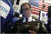  ?? AP PHOTO/RICHARD DREW, FILE ?? Trader Sal Suarino works on the floor of the New York Stock Exchange.