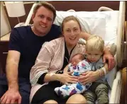  ?? COURTESY OF THE HART FAMILY ?? Kyle Hart, wife Kristin and son Liam, 2, pose with Ellie after her birth last week. Just days later, Kyle Hart was dead.