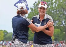  ?? BRIAN SPURLOCK, USA TODAY SPORTS ?? Lexi Thompson, right, celebrates with U.S. captain Juli Inkster on the 18th green after rallying to earn a half-point.
