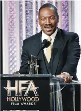  ??  ?? Eddie Murphy accepts the Hollywood career achievemen­t award at the 20th annual Hollywood Film Awards at the Beverly Hilton Hotel.