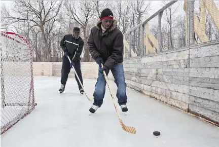  ?? DAVE SIDAWAY/FILES ?? Gilbert Nshimiyumu­kiza, front, and roommate Mukiza Jean-Baptiste, back in 2010, were both Rwandan orphans of the 1994 genocide and had taken up skating a year into their life in Montreal.