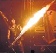  ??  ?? A FLAME-SPEWING bass guitar is nimbly wielded by Sixx during the classic Crüe anthem “Shout at the Devil.”