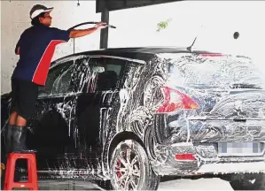  ??  ?? Quick wash: Depressed prices for car wash services make it difficult for product suppliers to raise prices.
