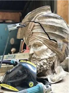  ??  ?? The bronze head of the statue in Luke Perry’s workshop
