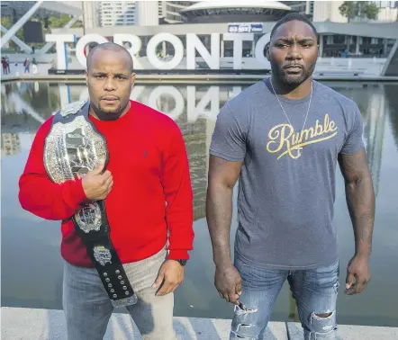  ?? — POSTMEDIA NEWS FILES ?? UFC light heavyweigh­t champion Daniel Cormier, left, and Anthony ‘Rumble’ Johnson will fight at UFC 210 this weekend in Buffalo in a rematch of their 2015 fight, which Cormier won.