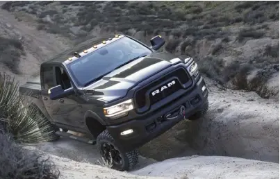  ??  ?? The 6.4L HEMI may be the base motor in Ram’s HD line, but provides more than enough power and torque to haul a hefty load or drift through a loose two-track corner.