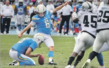 ?? Jae C. Hong Associated Press ?? CHARGERS’ Caleb Sturgis, kicking a field goal against the Oakland Raiders on Oct. 7, appears ready to return from a quadriceps injury.