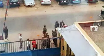  ??  ?? Soldiers invaded Daily Trust headquarte­rs in Abuja last Sunday. The media outfit was shut down for some hours and computer sets confiscate­d