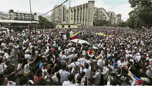  ?? — AP ?? People power: People gathering in Caracas to protest against the government and pay homage to the slain protesters.