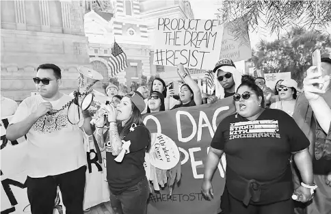  ??  ?? Immigrants and supporters chant outside the New York-New York Hotel and Casino on the Las Vegas Strip during a ‘We Rise for the Dream’ rally in Las Vegas, Nevada. — AFP photo