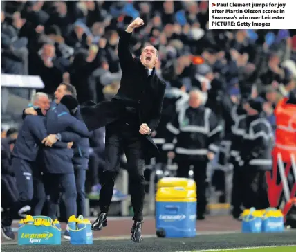  ??  ?? > Paul Clement jumps for joy after Martin Olsson scores in Swansea’s win over Leicester PICTURE: Getty Images