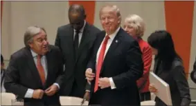  ?? THE ASSOCIATED PRESS ?? President Donald Trump, center, gets up to leave after making a quick statement at a meeting during the United Nations General Assembly at U.N. headquarte­rs Monday.