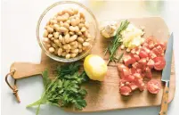  ?? ?? Ingredient­s for this hearty dish include beans, parsley, rosemary, garlic, a lemon and tomatoes.