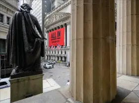  ?? (AP/Mary Altaffer) ?? A statue of George Washington stands near the New York Stock Exchange. The S&P 500 this month hit its most expensive level since late 2000, when measured in relation to corporate profits.