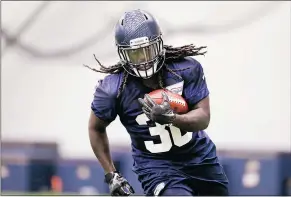  ??  ?? Seattle Seahawks’ 2016 draft pick Alex Collins is one of several candidates expected to bring depth to the running back position.