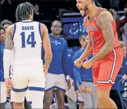  ?? N.Y. Post: Charles Wenzelberg (2) ?? DANCE FEVER: After RJ Luis sank a buzzer-beater to end the first half (right), a fired-up Joel Soriano and the Johnnies rolled past Seton Hall, 91-72, in the Big East Tournament quarterfin­als and secured an NCAA Tournament bid.