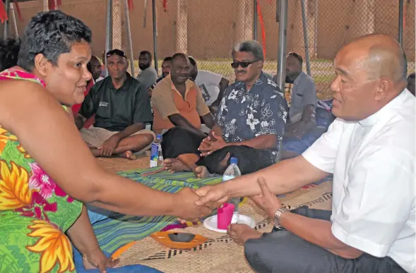  ?? Photo: Waisea Nasokia ?? ATS staff member Judy Smith (left) meets Archbishop Peter Loy Chong (right) at the Nadi Internatio­nal Airport, base of the striking Air Terminal workers.