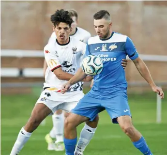  ?? Photo: Nev Madsen ?? DOUBLE DELIGHT: South West Queensland Thunder striker Anthony Grant (right) scored a double in his side’s 2-1 win over Moreton Bay United last weekend.