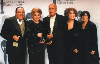  ?? Albert Ferreira / Associated Press 1999 ?? The Staple Singers — Pervis (left), Cleotha, Pops, Mavis and Yvonne — were inducted into the Rock and Roll Hall of Fame in 1999. They received a lifetime achievemen­t Grammy in 2005.