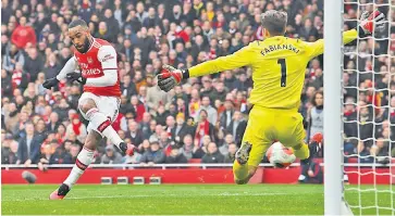  ??  ?? Sub standard: Arsenal replacemen­t Alexandre Lacazette shows the quality needed to secure a fortuitous victory over West Ham