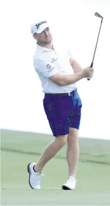  ?? - AFP photo ?? Graeme McDowell of Northern Ireland plays a shot during a practice round prior to The PLAYERS Championsh­ip at the TPC Stadium course on March 11, 2020 in Ponte Vedra Beach, Florida.