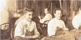  ?? LIBRARY OF CONGRESS ?? Young women make cigars at a Tampa factory in 1909.