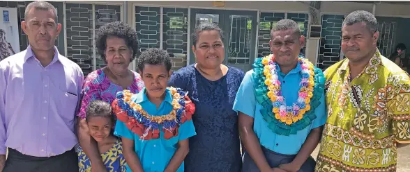  ?? Photo: Inoke Rabonu. ?? Fiji Vocational Technical Training Centre for Persons with Disabiliti­es head girl Milika Turaga (fourth from left) and head boy Vilimone Baleinayau (second from right) with their families during their prefects induction in Suva on February 8, 2020.